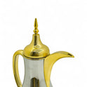 A golden Arabic coffee bottle with an artistic character - Mawaeen